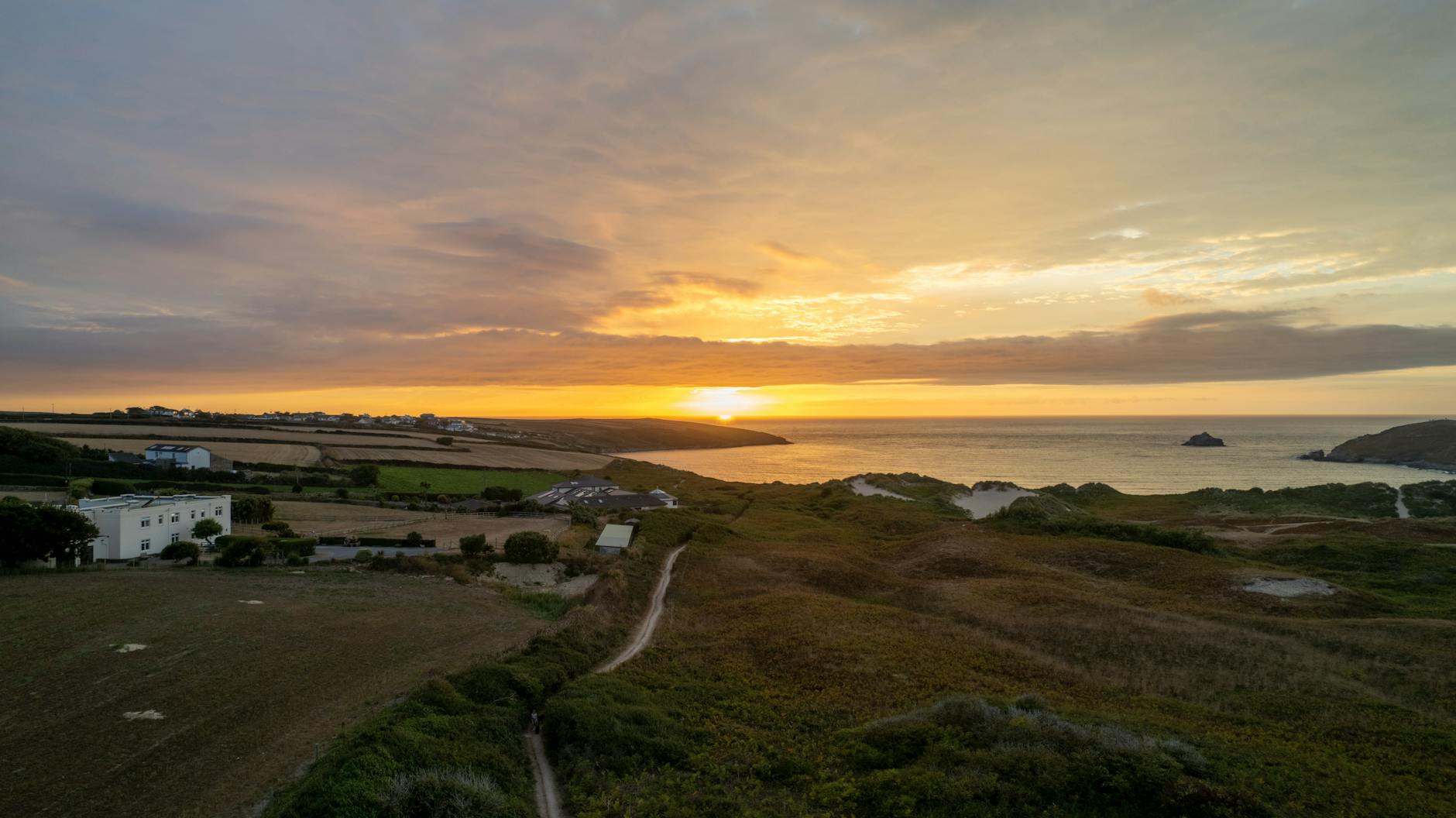 Cornish coast at sunrise from a train window